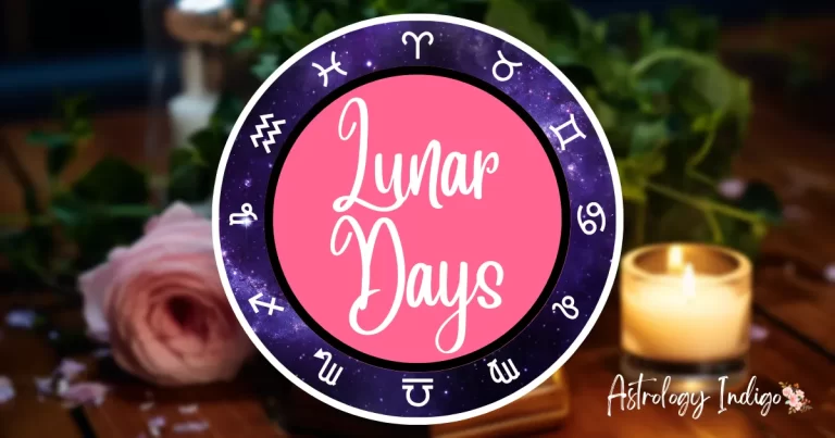 An image of the Zodiac signs in a circle around the words Lunar Days sits in front of a desk with flowers and candles