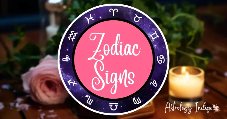 An image of the Zodiac signs in a circle around the words Zodiac Signs sits in front of a desk with flowers and candles